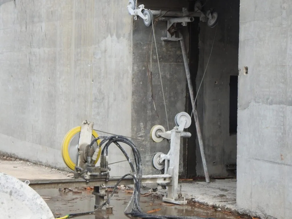 Concrete floor saw making a straight cut along a marked line