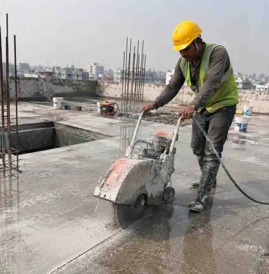 Walk-behind saw cutting a concrete surface outdoors